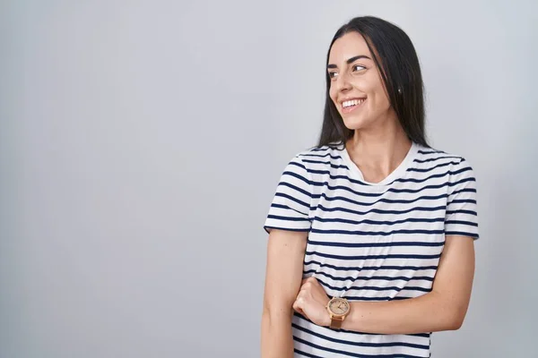 Young Brunette Woman Wearing Striped Shirt Looking Away Side Smile — Stock Photo, Image