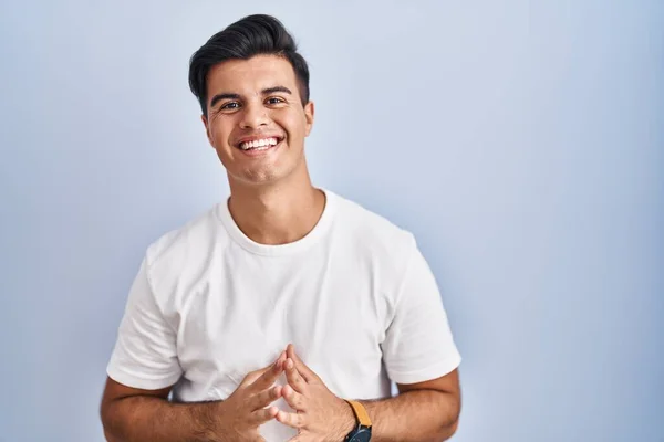 Hispanic Man Standing Blue Background Hands Together Fingers Crossed Smiling — Stock Photo, Image