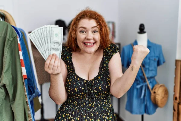 Young Redhead Woman Holding Shopping Bags Dollars Screaming Proud Celebrating — Stock Photo, Image