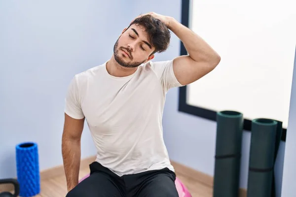 Young Hispanic Man Sitting Fit Ball Stretching Sport Center — Foto de Stock