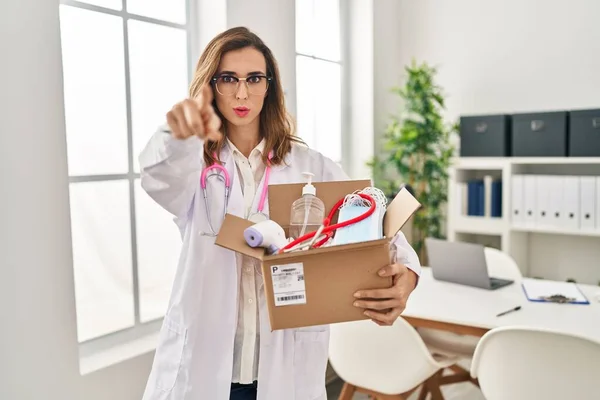 Young Doctor Woman Holding Box Medical Items Pointing Finger Camera — Stock Photo, Image
