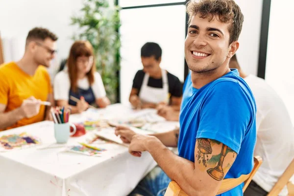 Group of people drawing at art studio.