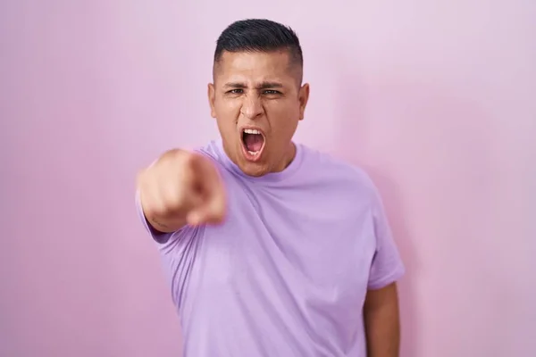 Young Hispanic Man Standing Pink Background Pointing Displeased Frustrated Camera — Stockfoto
