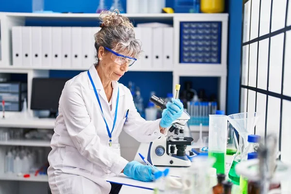 Middle Age Woman Scientist Writing Clipboard Holding Test Tube Laboratory — Stock Photo, Image