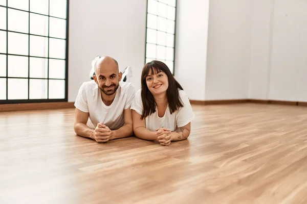 Young Hispanic Couple Smiling Happy Lying Floor Empty New Home — Stock Photo, Image