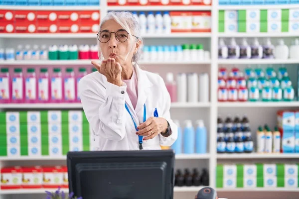 Middle Age Woman Tattoos Working Pharmacy Drugstore Looking Camera Blowing — Stock Photo, Image