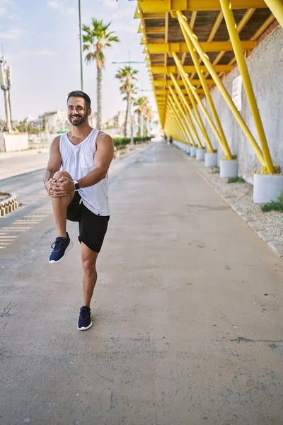 Hispanic Man Stretching Working Out Outdoors Sunny Day — Stock Photo, Image