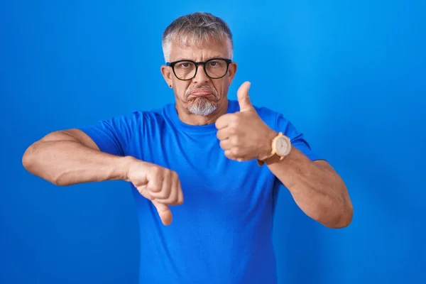 Hispanic Man Grey Hair Standing Blue Background Doing Thumbs Disagreement — Stock Photo, Image