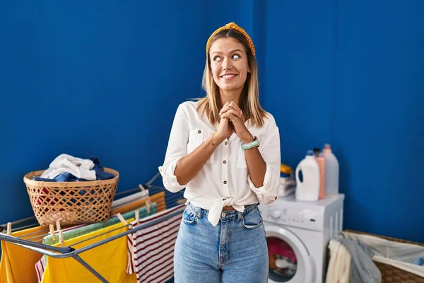 Young Blonde Woman Laundry Room Laughing Nervous Excited Hands Chin — Stock Photo, Image