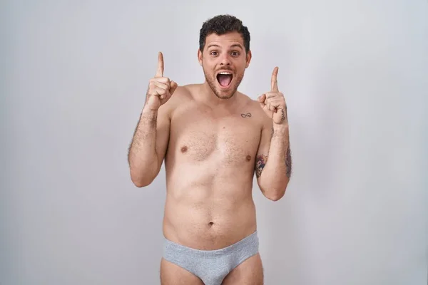Young Hispanic Man Standing Shirtless Wearing Underware Smiling Amazed Surprised — Stock Photo, Image