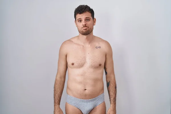 Young Hispanic Man Standing Shirtless Wearing Underware Depressed Worry Distress — Stock Photo, Image