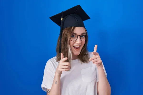 Blonde Caucasian Woman Wearing Graduation Cap Pointing Fingers Camera Happy — Stock Photo, Image