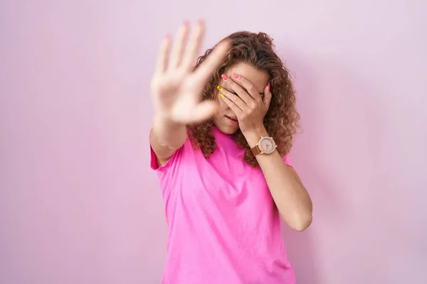 Young Caucasian Woman Standing Pink Background Covering Eyes Hands Doing — Zdjęcie stockowe