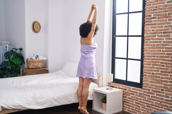 Young Middle East Woman Stretching Arms Standing Bedroom — Stok Foto