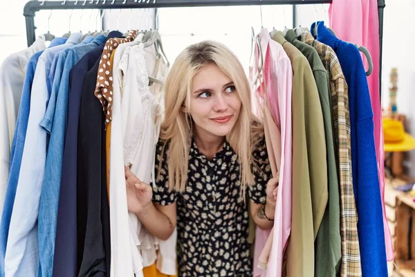 Young Blonde Woman Searching Clothes Clothing Rack Smiling Looking Side — Stock Photo, Image