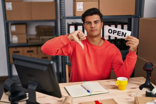 Hispanic Man Working Small Business Ecommerce Holding Open Banner Angry — Stock Photo, Image