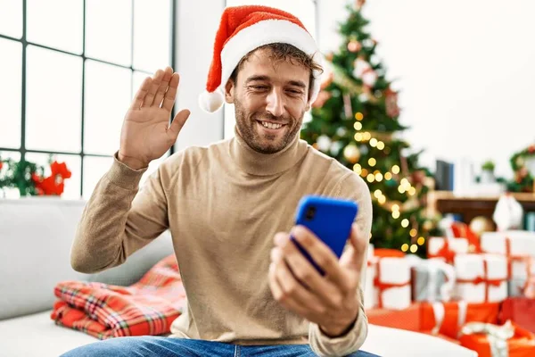 Young Hispanic Man Having Video Call Sitting Christmas Tree Home — Φωτογραφία Αρχείου