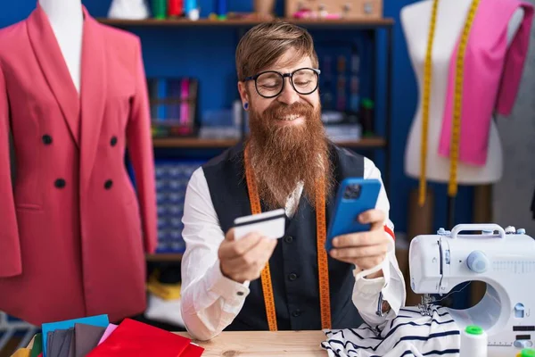 Young Redhead Man Tailor Using Smartphone Credit Card Clothing Factory — Stock Fotó