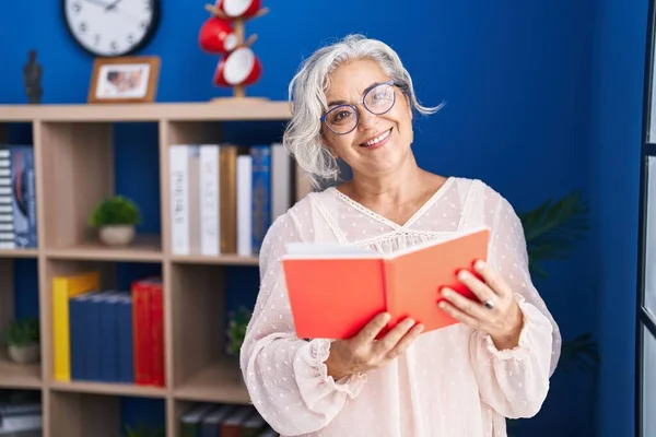 Middle Age Grey Haired Woman Reading Book Standing Home — Stock Photo, Image