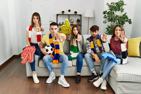 Group Young People Watching Football Game Wearing Team Scarf Cheering — ストック写真