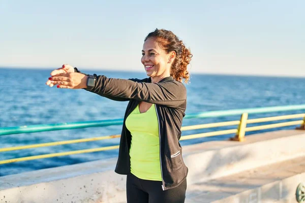 Middle Age Hispanic Woman Stretching Arms Promenade — Stock Photo, Image