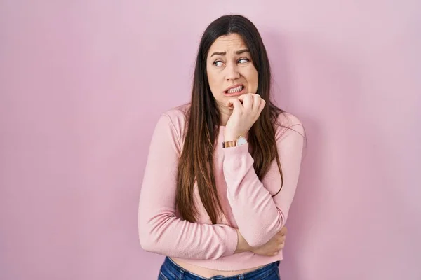 Young Brunette Woman Standing Pink Background Looking Stressed Nervous Hands — Stok fotoğraf