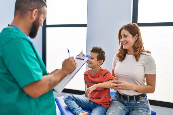 Family having physiotherapy session at rehab clinic