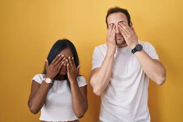 Interracial Couple Standing Yellow Background Rubbing Eyes Fatigue Headache Sleepy — Zdjęcie stockowe
