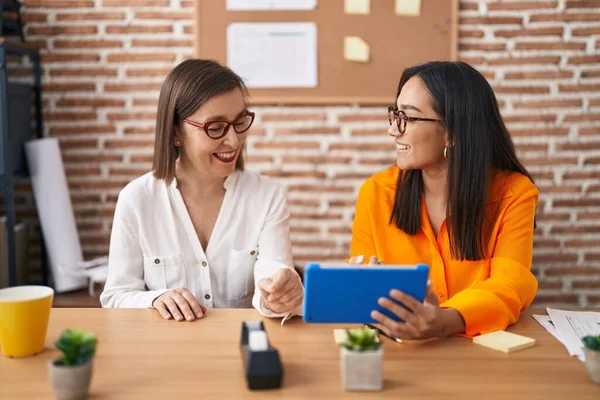 Two Women Business Workers Using Touchpad Working Office — 스톡 사진