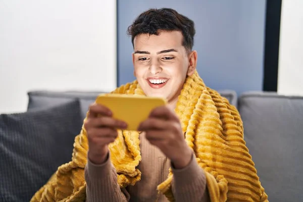 Young Non Binary Man Playing Video Game Smartphone Home — Stockfoto