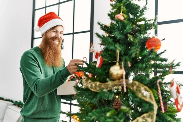 Young Redhead Man Smiling Confident Decorating Christmas Tree Home — Zdjęcie stockowe