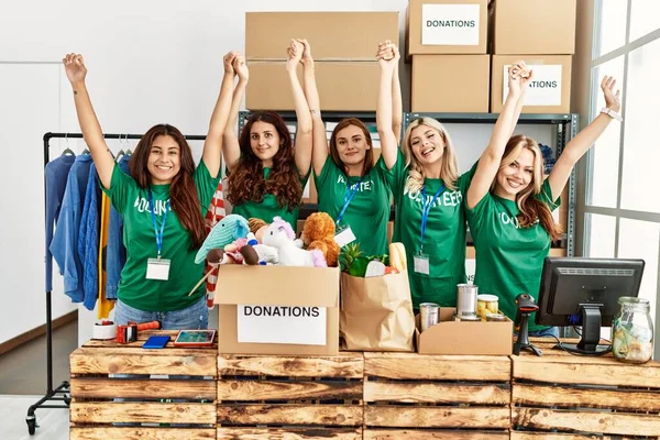 Group Young Volunteers Woman Smiling Happy Hands Raised Charity Center — Stock Photo, Image