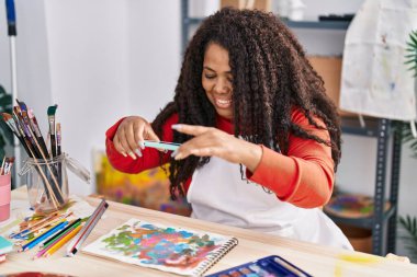African american woman artist make photo by smartphone to draw at art studio