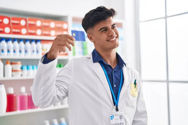 Young Hispanic Man Pharmacist Smiling Confident Holding Credit Card Pharmacy — Stock Photo, Image