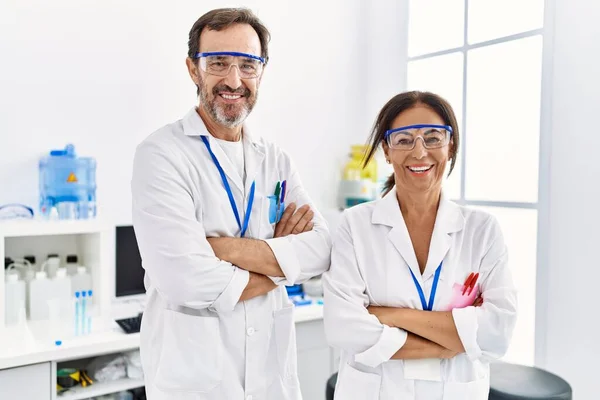 Middle Age Man Woman Partners Wearing Scientist Uniform Standing Arms — Stock Photo, Image