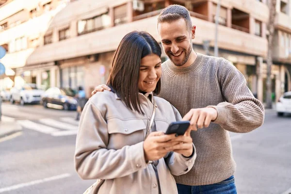 Man Woman Couple Smiling Confident Using Smartphone Street — ストック写真