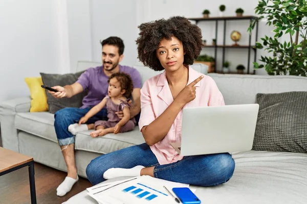 Mother Interracial Family Working Using Computer Laptop Home Pointing Hand — Stok fotoğraf