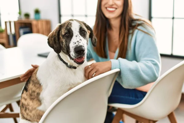 Young Woman Smiling Confident Sitting Table Dog Home — 스톡 사진