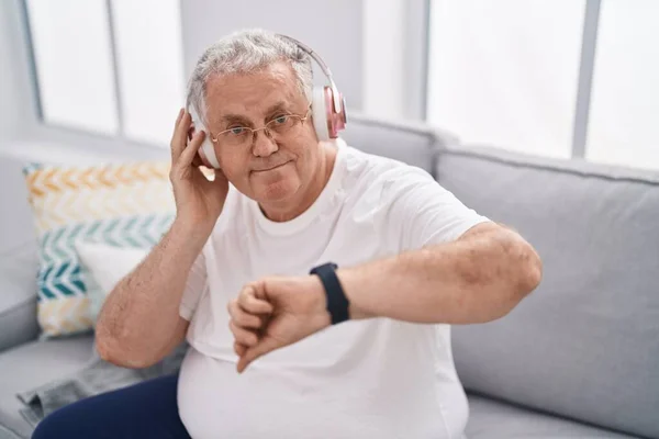Middle Age Grey Haired Man Listening Music Looking Watch Home — Stock Photo, Image