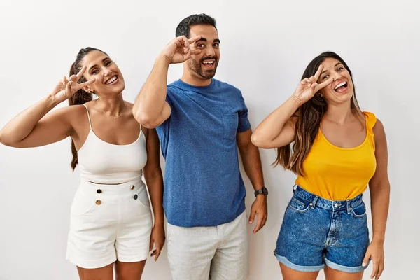 Group Young Hispanic People Standing Isolated Background Doing Peace Symbol — Stock Photo, Image
