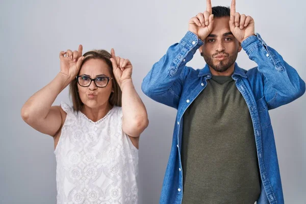 Hispanic Mother Son Standing Together Doing Funny Gesture Finger Head — Stock Photo, Image