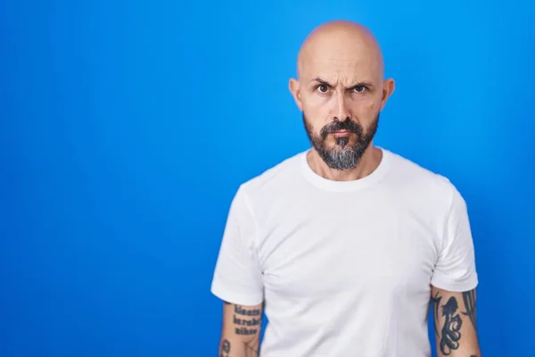 Hispanic Man Tattoos Standing Blue Background Skeptic Nervous Frowning Upset — Stock Photo, Image