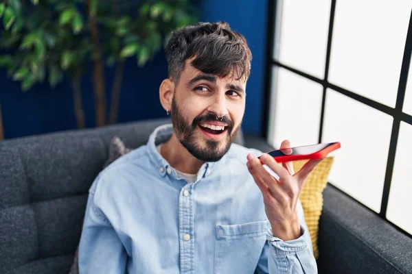 Young Hispanic Man Talking Smartphone Sitting Sofa Home — 스톡 사진