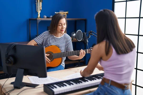 Two Women Musicians Playing Classical Guitar Piano Music Studio — Stok fotoğraf