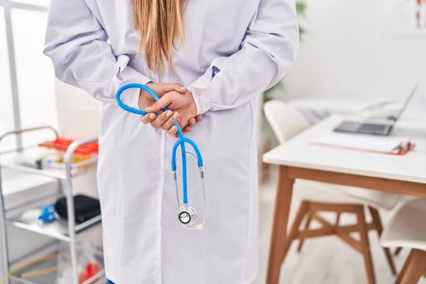 Young Beautiful Hispanic Woman Doctor Holding Stethoscope Standing Back View — Stockfoto