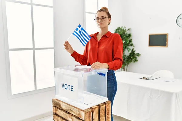 Young Brunette Woman Putting Envelop Ballot Box Holding Greece Flag — Stock Photo, Image