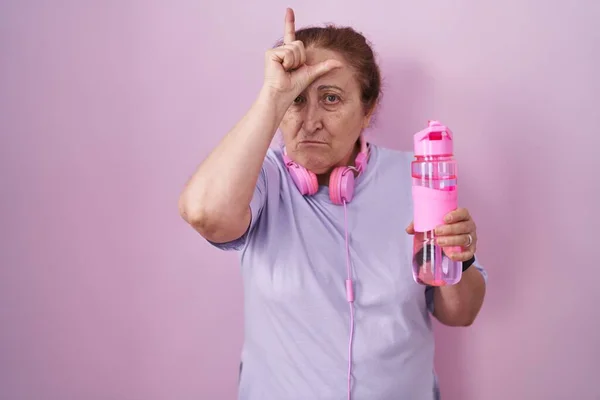 Senior Woman Wearing Sportswear Headphones Making Fun People Fingers Forehead — Stock Photo, Image