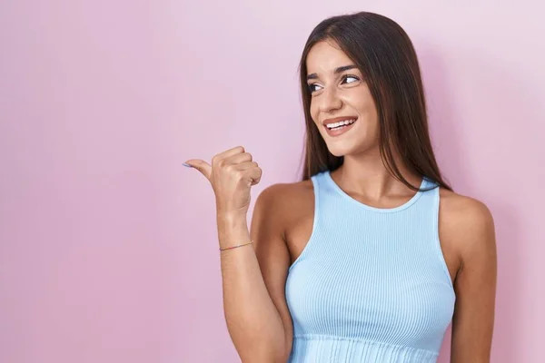 Young Brunette Woman Standing Pink Background Smiling Happy Face Looking —  Fotos de Stock