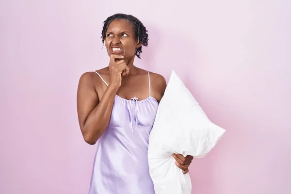 African Woman Dreadlocks Wearing Pajama Hugging Pillow Thinking Worried Question —  Fotos de Stock