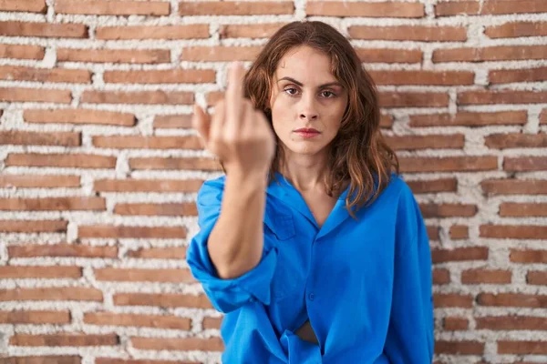 Beautiful Brunette Woman Standing Bricks Wall Showing Middle Finger Impolite — стоковое фото